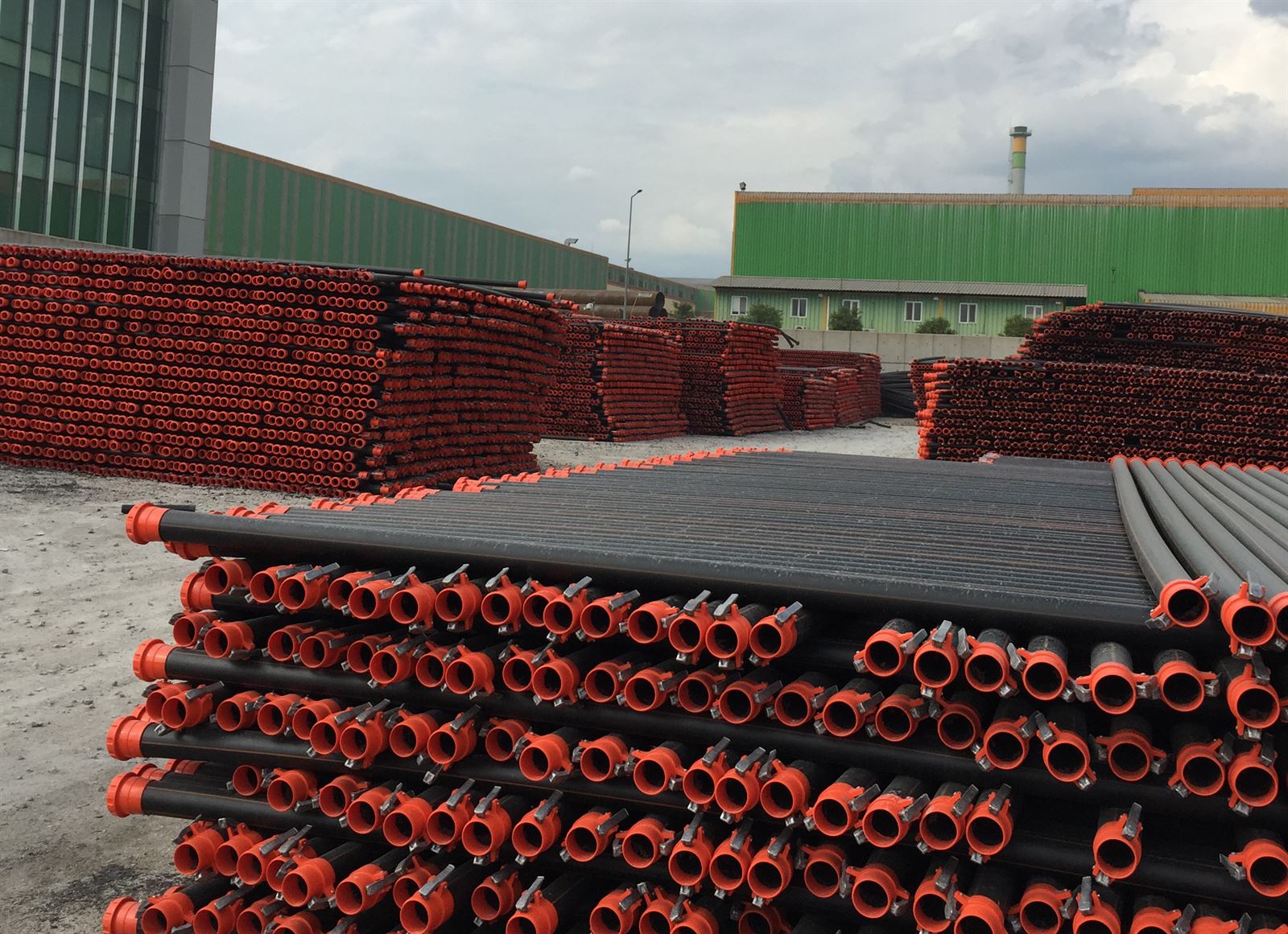 PE coil pipes and couplings stacked at the factory yard